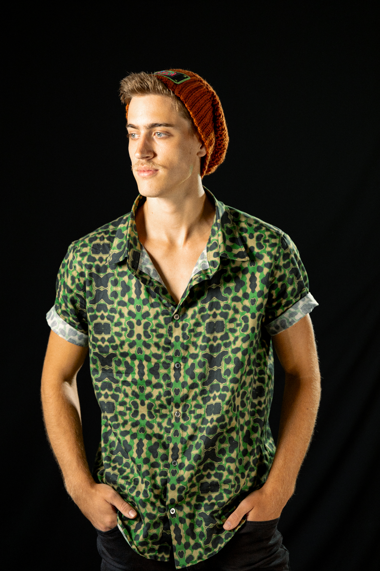 Ape Outfitters model in green print camp shirt